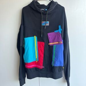 Cookies brand sweater. Size extra large, colorful, patchwork sweater small tear.